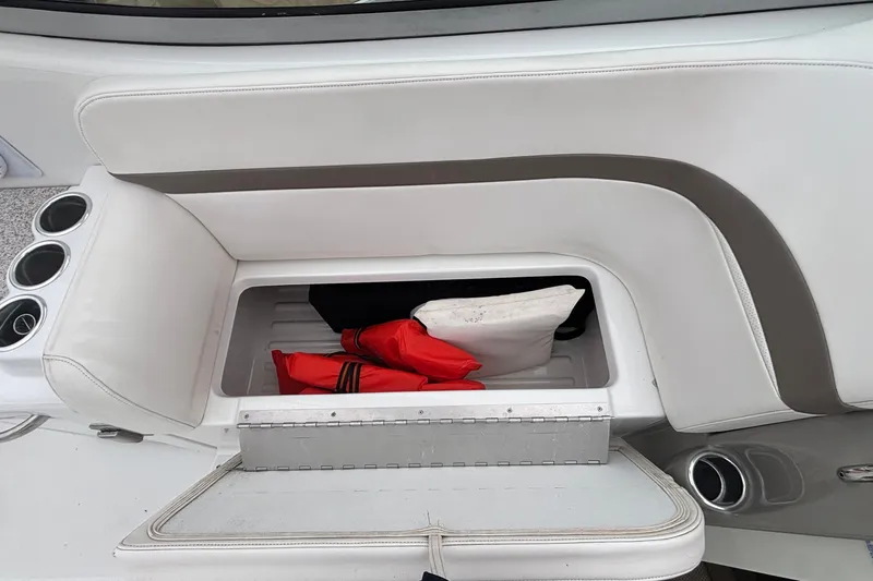 Slide: The Image of 2005 Formula 31 Performance Cruiser storage compartment with life jackets and cushions. - 32