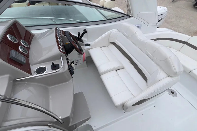 Slide: The Image of 2005 Formula 31 Performance Cruiser cockpit with white seating and control panel. - 33