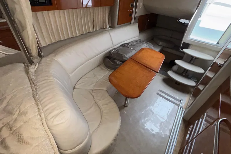 Slide: The Image of Interior of 2005 Formula 31 Performance Cruiser with curved seating and wooden table. - 36