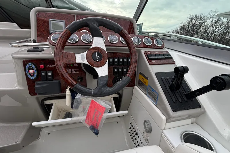 Slide: The Image of 2005 Formula 31 Performance Cruiser dashboard with steering wheel and control panel. - 4
