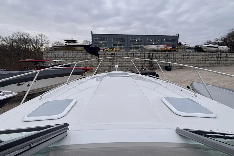 Slide: The Image of 2005 Formula 31 Performance Cruiser on display at a marina with other boats. - 45