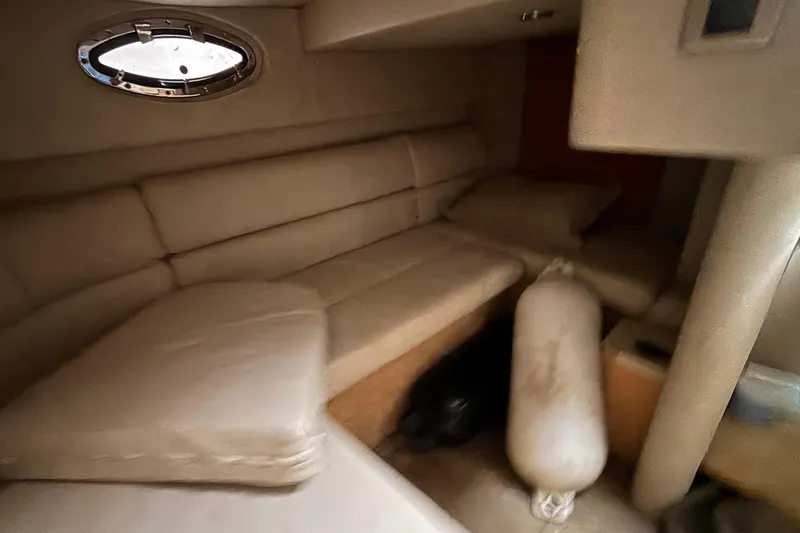 Slide: The Image of Interior of 2005 Formula 31 Performance Cruiser with beige seating and porthole window. - 47