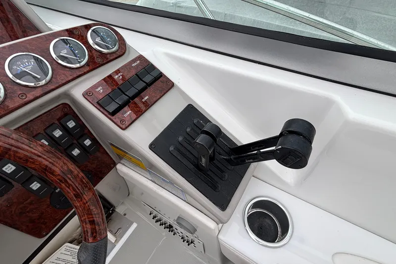 Slide: The Image of Control panel of a 2005 Formula 31 Performance Cruiser boat with throttle and gauges. - 5