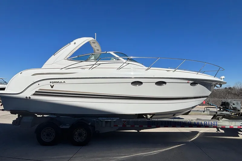 Slide: The Image of 2005 Formula 31 Performance Cruiser boat on trailer under clear blue sky. - 50