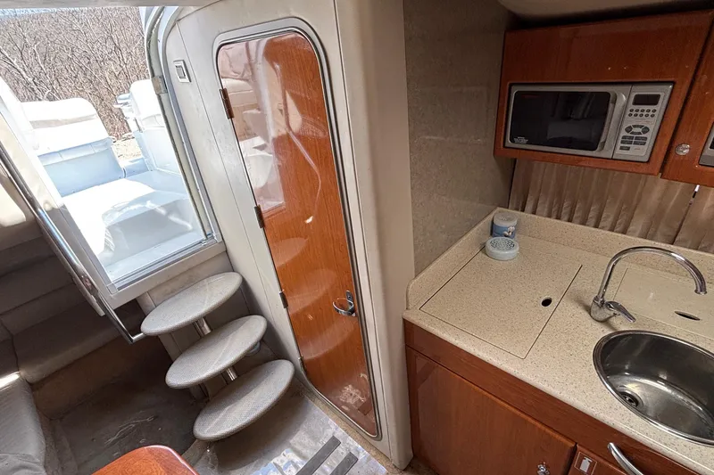 Slide: The Image of Interior of a 2005 Formula 31 Performance Cruiser with kitchenette and stairs. - 53