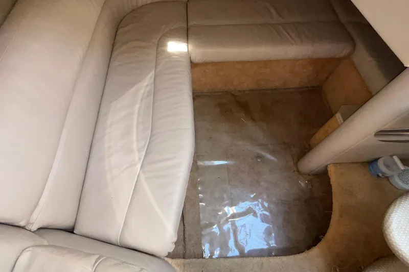 Slide: The Image of Interior of a 2005 Formula 31 Performance Cruiser with beige seating and carpet. - 56