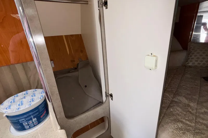 Slide: The Image of Interior of 2005 Formula 31 Performance Cruiser showing storage and bedding area. - 65