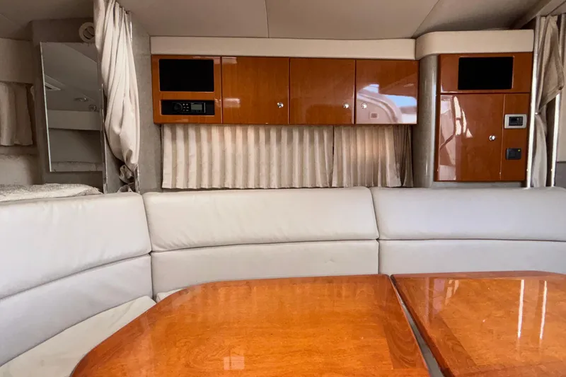 Slide: The Image of Interior of a 2005 Formula 31 Performance Cruiser with wood cabinetry and beige seating. - 69