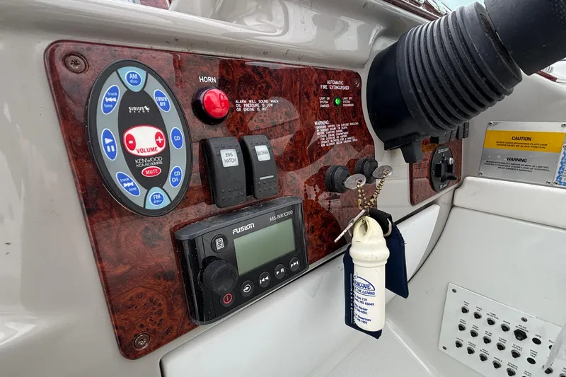 Slide: The Image of Control panel of a 2005 Formula 31 Performance Cruiser with audio and safety features. - 8