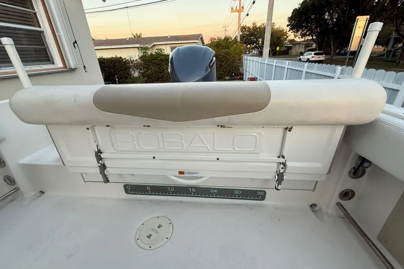 Slide: The Image of 2018 Robalo R242 Center Console boat interior with seating and measuring scale. - 39