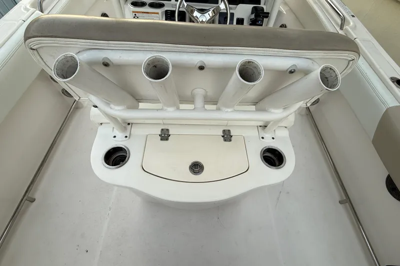 Slide: The Image of 2018 Robalo R242 Center Console boat with rod holders and storage compartment. - 41