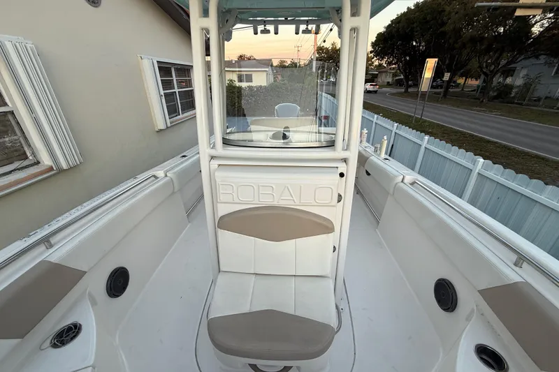 Slide: The Image of 2018 Robalo R242 Center Console boat interior with seating and console view. - 43