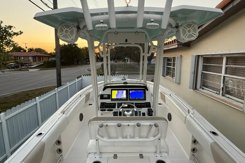 Slide: The Image of 2018 Robalo R242 Center Console boat with dual displays at sunset. - 46