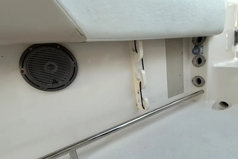 Slide: The Image of 2018 Robalo R242 Center Console interior with speaker and rod holders. - 48