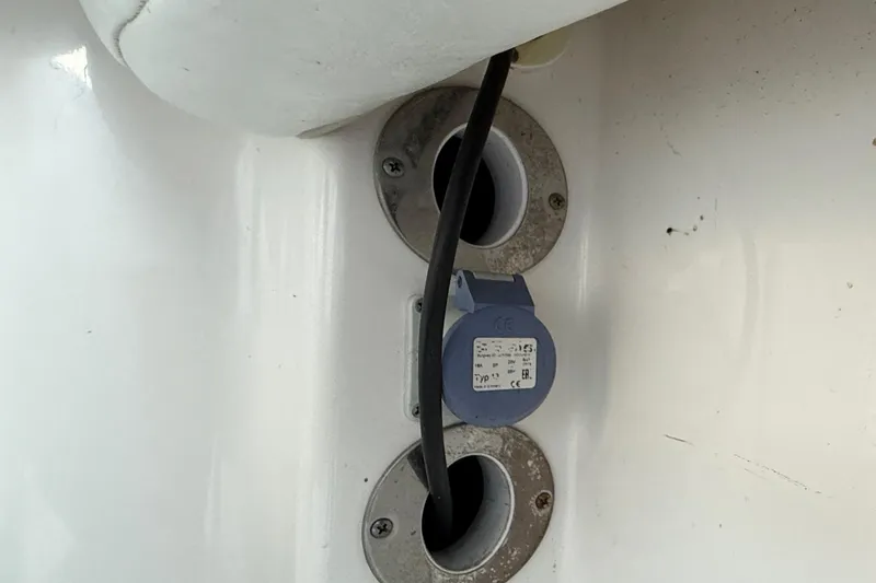 Slide: The Image of Power cable and socket on 2018 Robalo R242 Center Console boat. - 49