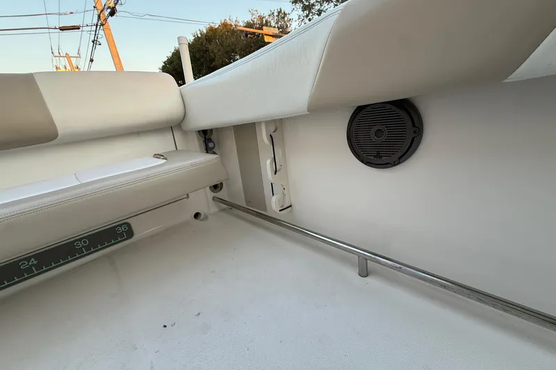 Slide: The Image of 2018 Robalo R242 Center Console interior with seating and speaker detail. - 52