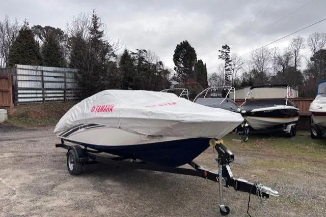 Slide: The Image of 2017 Yamaha SX190 boat covered on trailer in outdoor storage area. - 4