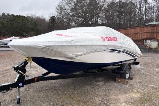 Slide: The Image of 2017 Yamaha SX190 boat covered on trailer in outdoor setting. - 5