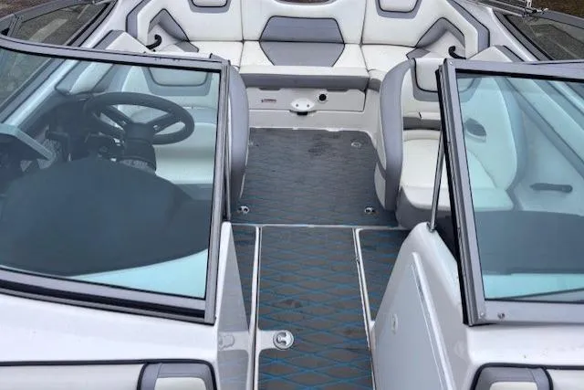 Slide: The Image of 2017 Yamaha Boats SX190 interior with seating and steering wheel, featuring modern design elements. - 8