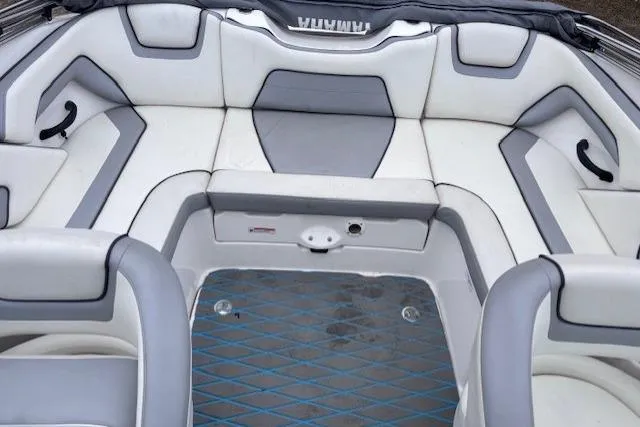 Slide: The Image of 2017 Yamaha Boats SX190 interior with gray and white seating arrangement. - 9