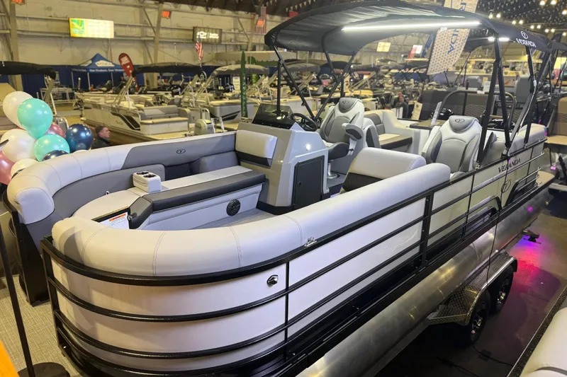 Slide: The Image of 2026 Veranda VS 22 RC pontoon boat on display at an indoor boat show. - 0