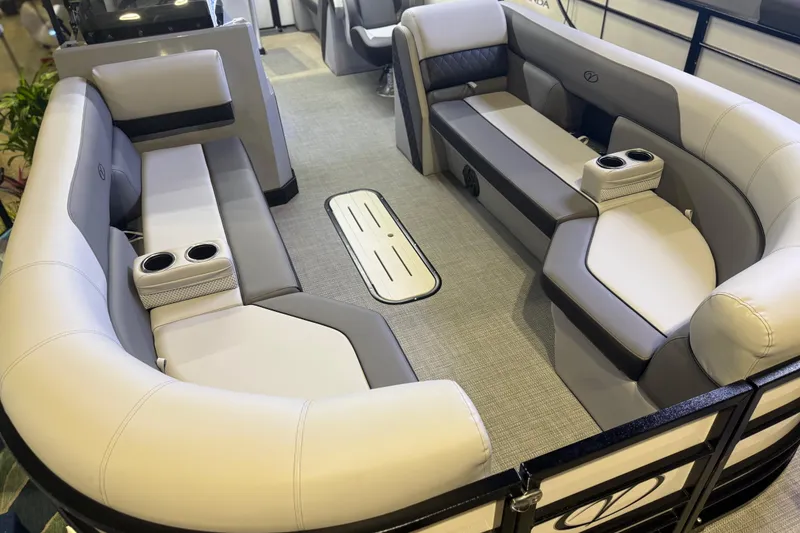 Slide: The Image of 2026 Veranda VS 22 RC pontoon boat interior with plush seating and cup holders. - 7