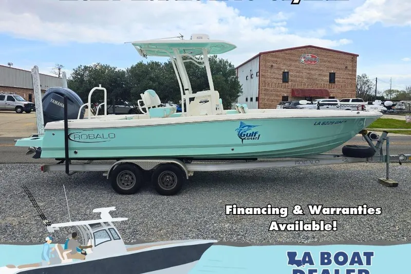 Slide: The Image of 2021 Robalo 246 Cayman boat on trailer, available for financing and warranties. - 0