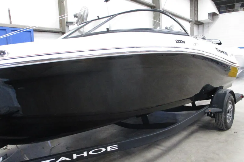 The Image of 2025 Tahoe 200 S boat on trailer in indoor setting. - 1