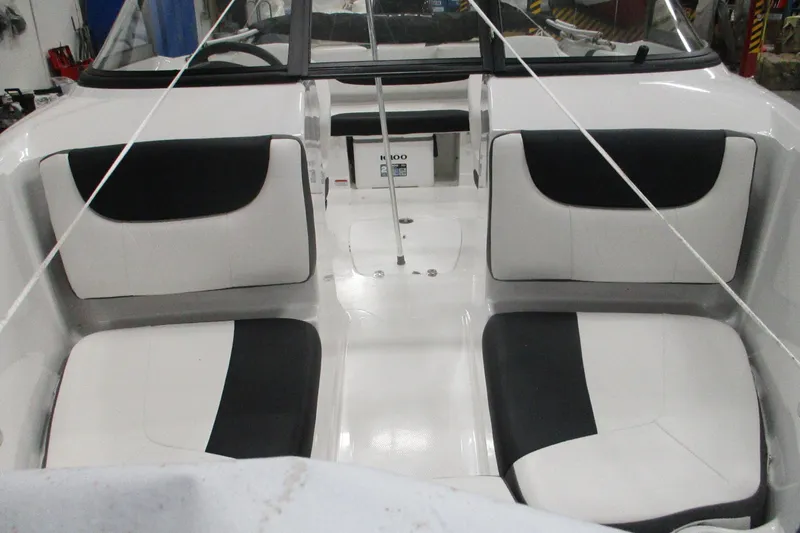 Slide: The Image of 2025 Tahoe 200 S boat interior with black and white seating arrangement. - 3