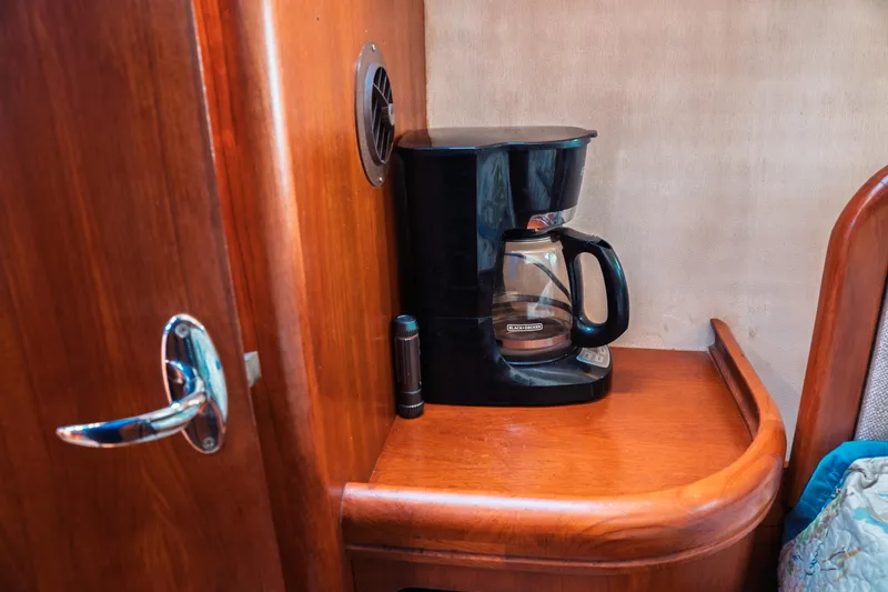 Slide: The Image of Coffee maker on wooden shelf inside 2003 Hunter 356 boat cabin. - 16