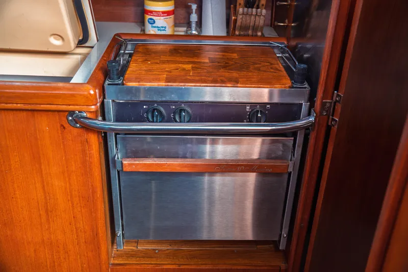 Slide: The Image of Compact marine stove with wooden countertop in a 2003 Hunter 356 yacht kitchen. - 33