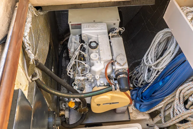 Slide: The Image of Engine compartment of a 2003 Hunter 356 sailboat with ropes and equipment. - 36