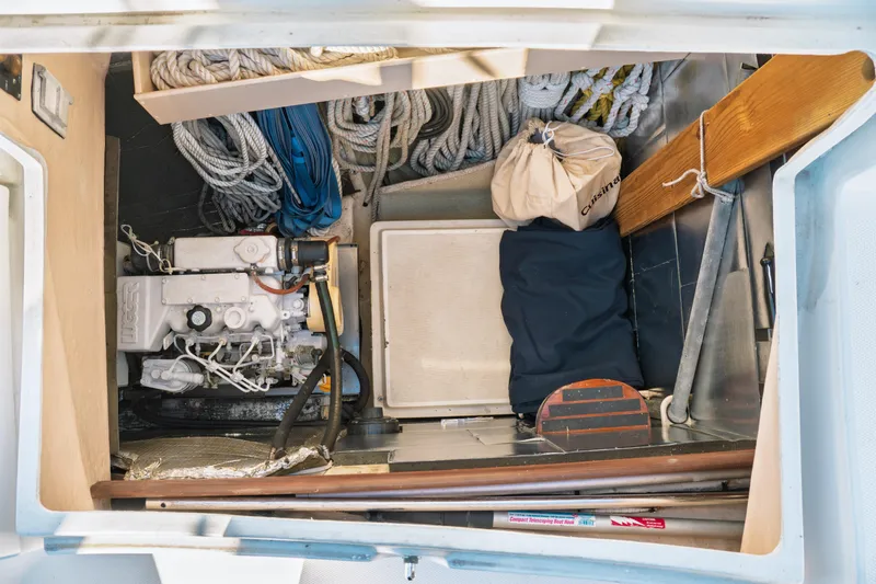 Slide: The Image of Storage compartment of a 2003 Hunter 356 sailboat with ropes and equipment. - 37