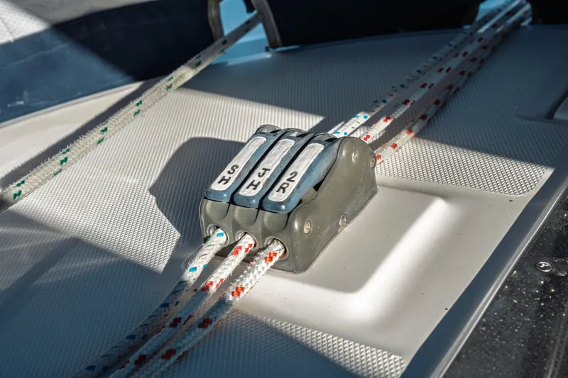 Slide: The Image of Close-up of a 2003 Hunter 356 sailboat rope clutches on deck. - 8