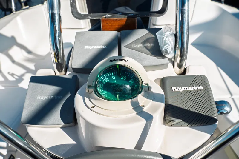 Slide: The Image of Boat cockpit with Raymarine equipment and Danforth compass, Hunter 356, 2003 model. - 9