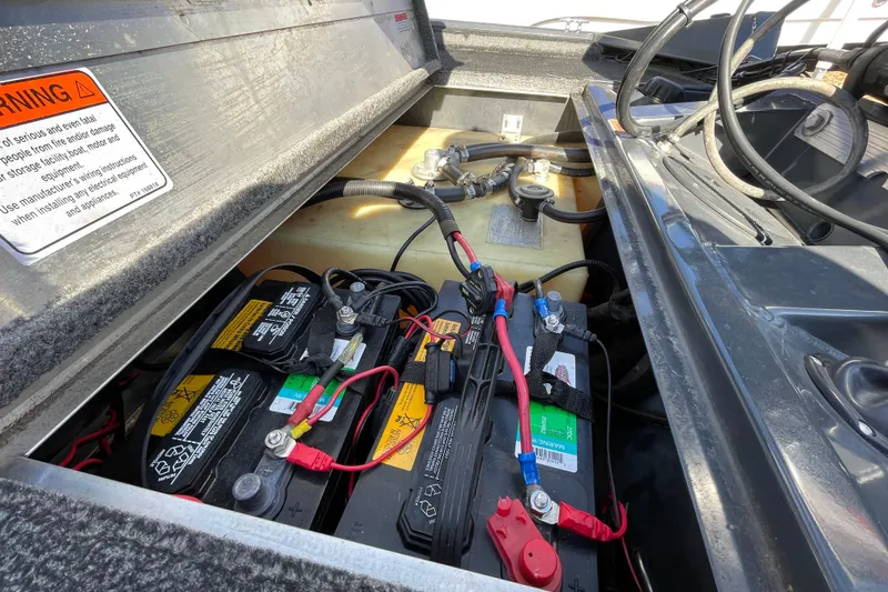 Slide: The Image of Battery compartment of a 2015 Tracker Pro Team 190 TX boat, showing wiring and connections. - 10