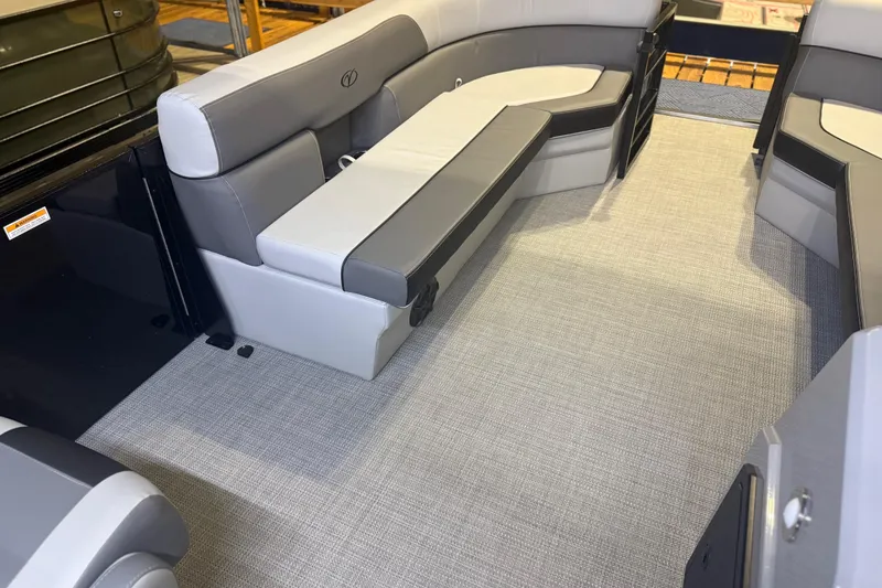 Slide: The Image of 2026 Veranda Relax VR22RC boat interior with gray seating and flooring. - 2