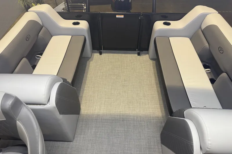 Slide: The Image of 2026 Veranda Relax VR22RC pontoon boat interior with gray seating and cup holders. - 5