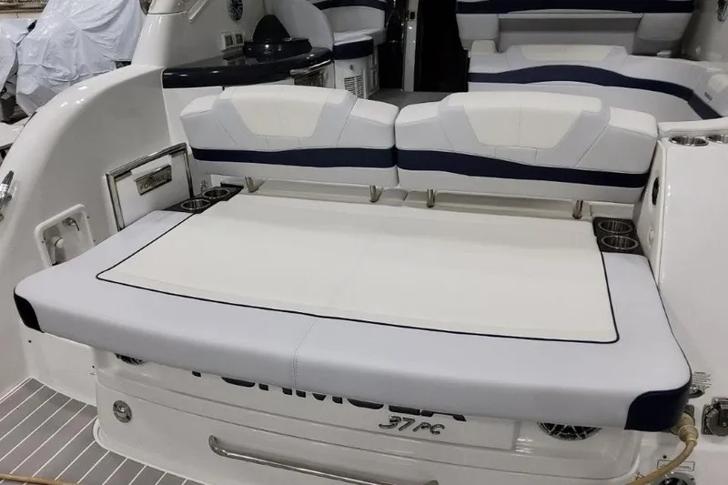 Slide: The Image of 2022 Formula 37 Performance Cruiser interior with white and navy seating. - 10