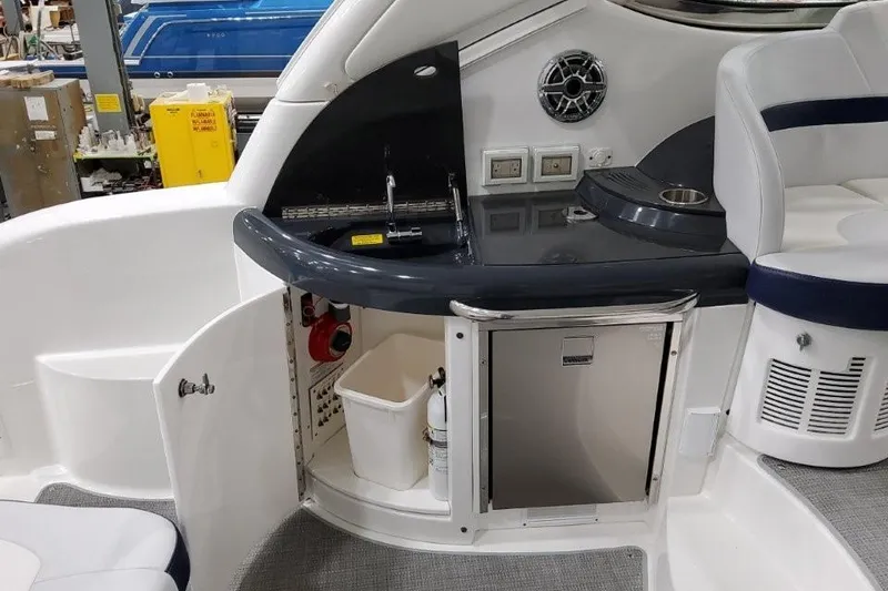 Slide: The Image of 2022 Formula 37 Performance Cruiser interior with kitchenette, sink, and seating area. - 14