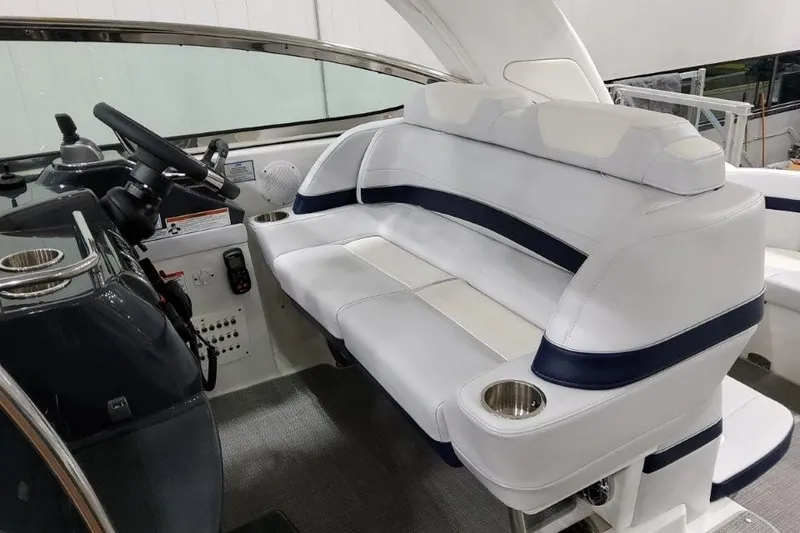 Slide: The Image of 2022 Formula 37 Performance Cruiser interior with white seating and steering console. - 15