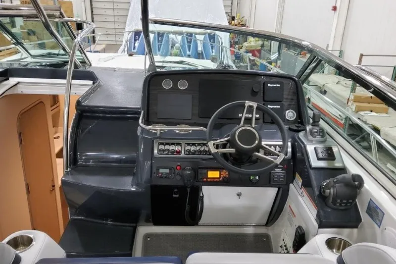 Slide: The Image of 2022 Formula 37 Performance Cruiser helm with modern navigation controls and steering wheel. - 16