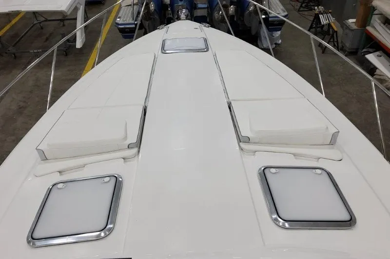 Slide: The Image of 2022 Formula 37 Performance Cruiser deck with hatches and seating in a workshop. - 18