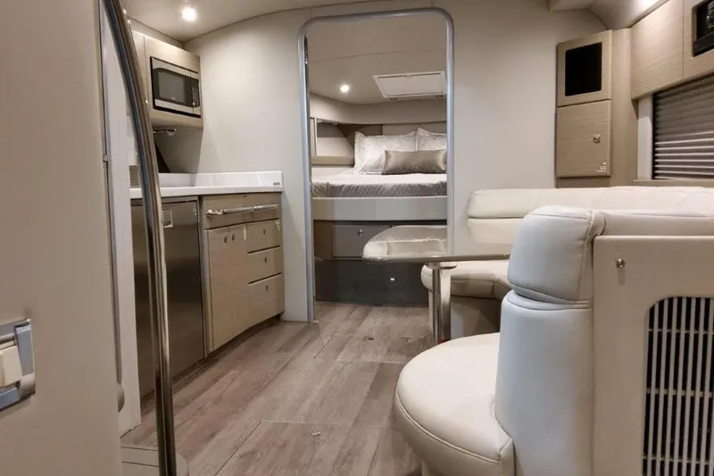 Slide: The Image of Interior of 2022 Formula 37 Performance Cruiser, featuring modern kitchen and cozy sleeping area. - 21