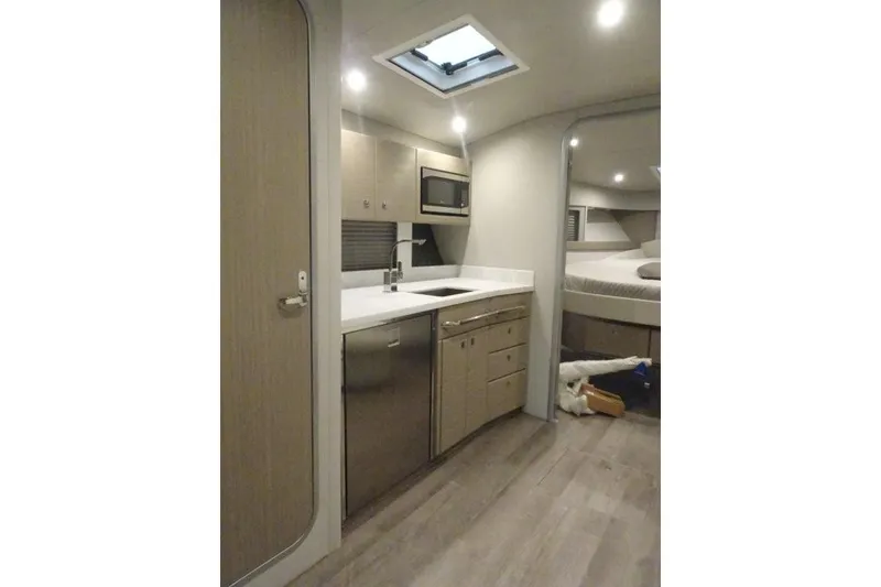 Slide: The Image of Interior of 2022 Formula 37 Performance Cruiser with modern kitchen and cozy sleeping area. - 29