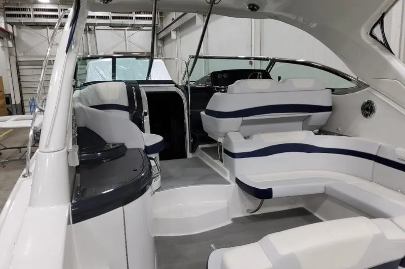 Slide: The Image of 2022 Formula 37 Performance Cruiser interior with white and navy seating in a spacious cabin. - 8