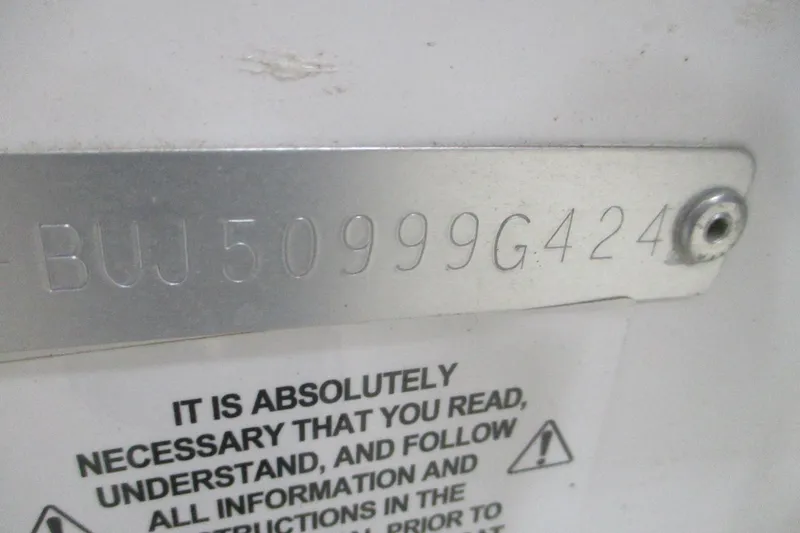 Slide: The Image of 2024 Tahoe 210 S Limited serial number plate with safety instructions. - 10