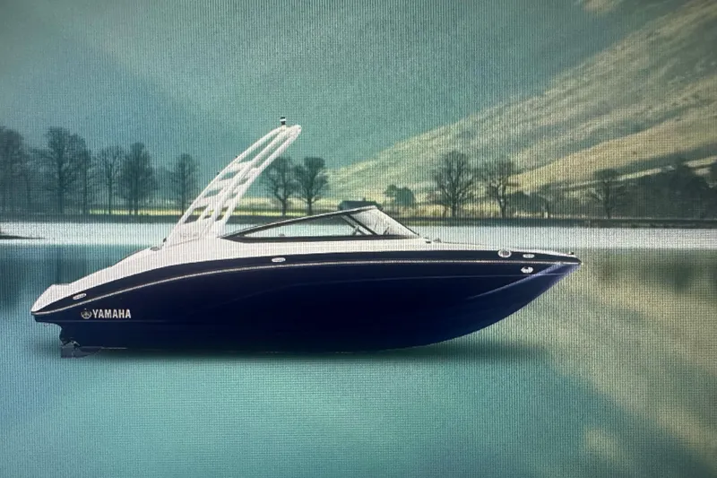 Slide: The Image of 2026 Yamaha Boats 195S on serene lake with scenic mountain backdrop. - 6