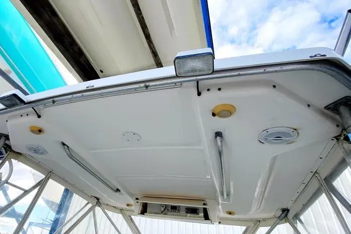 Slide: The Image of 2001 Pursuit 3000 Offshore boat canopy with lights and support structure. - 18