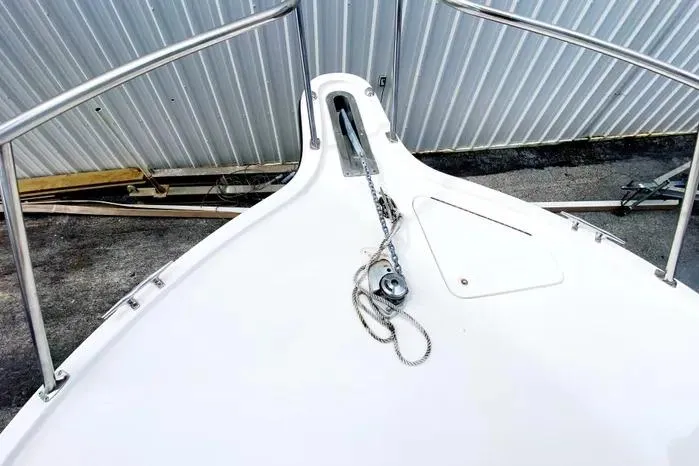 Slide: The Image of Bow of 2001 Pursuit 3000 Offshore boat with anchor chain and railing. - 9